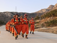 A comprehensive combat drill for forest fire emergency response takes place in Qingdao, China, on December 11, 2024. (