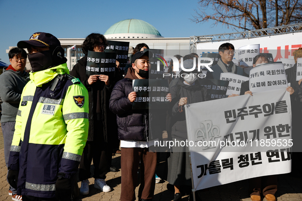 Approximately 50 members of the Catholic Youth Solidarity hold a press conference in front of the National Assembly in Yeouido, Seoul, South...