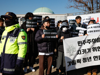 Approximately 50 members of the Catholic Youth Solidarity hold a press conference in front of the National Assembly in Yeouido, Seoul, South...