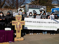 Approximately 50 members of the Catholic Youth Solidarity hold a press conference in front of the National Assembly in Yeouido, Seoul, South...