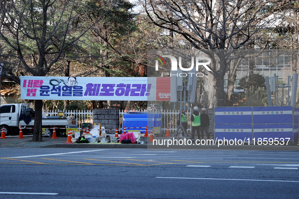 Telecommunications company employees install additional communication antennas around the National Assembly area in Yeouido, Seoul, South Ko...