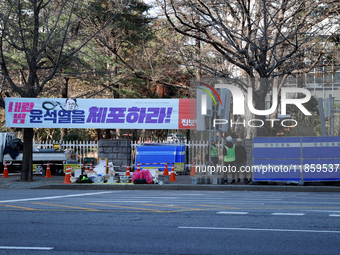 Telecommunications company employees install additional communication antennas around the National Assembly area in Yeouido, Seoul, South Ko...