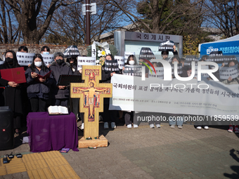 Approximately 50 members of the Catholic Youth Solidarity hold a press conference in front of the National Assembly in Yeouido, Seoul, South...