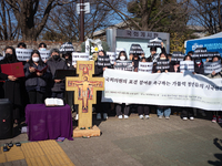 Approximately 50 members of the Catholic Youth Solidarity hold a press conference in front of the National Assembly in Yeouido, Seoul, South...