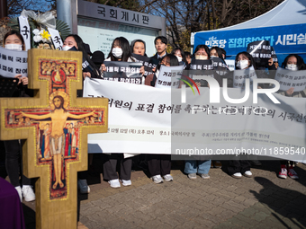 Approximately 50 members of the Catholic Youth Solidarity hold a press conference in front of the National Assembly in Yeouido, Seoul, South...