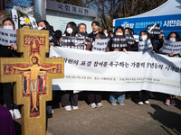 Approximately 50 members of the Catholic Youth Solidarity hold a press conference in front of the National Assembly in Yeouido, Seoul, South...