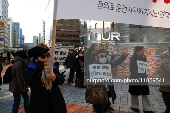 A small group of President Yoon Suk-yeol's supporters, primarily elderly individuals, holds a rally in front of the People Power Party's cen...