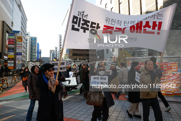 A small group of President Yoon Suk-yeol's supporters, primarily elderly individuals, holds a rally in front of the People Power Party's cen...