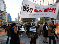 A small group of President Yoon Suk-yeol's supporters, primarily elderly individuals, holds a rally in front of the People Power Party's cen...