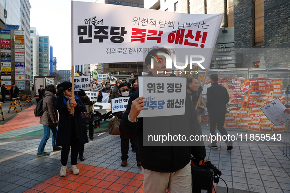 A small group of President Yoon Suk-yeol's supporters, primarily elderly individuals, holds a rally in front of the People Power Party's cen...