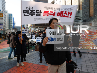 A small group of President Yoon Suk-yeol's supporters, primarily elderly individuals, holds a rally in front of the People Power Party's cen...