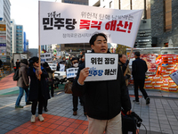 A small group of President Yoon Suk-yeol's supporters, primarily elderly individuals, holds a rally in front of the People Power Party's cen...