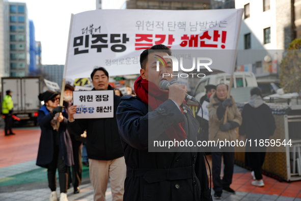 A small group of President Yoon Suk-yeol's supporters, primarily elderly individuals, holds a rally in front of the People Power Party's cen...