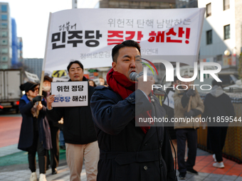 A small group of President Yoon Suk-yeol's supporters, primarily elderly individuals, holds a rally in front of the People Power Party's cen...