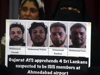 A family member holds placards of the suspects during a press conference in Colombo, Sri Lanka, on December 12, 2024. Four Sri Lankan nation...