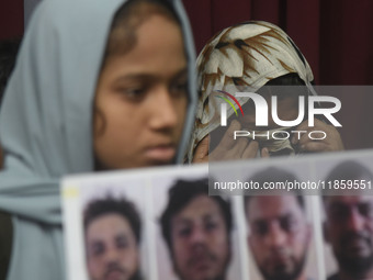 Family members wipe his tears at a media conference in Colombo, Sri Lanka, on December 12, 2024. Four Sri Lankan nationals are arrested by I...