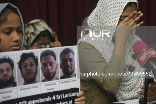 Family members wipe his tears at a media conference in Colombo, Sri Lanka, on December 12, 2024. Four Sri Lankan nationals are arrested by I...