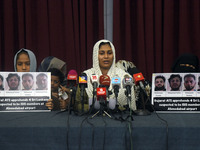 A family member of M.R.F. Shakeena, the wife of Mohammed Nafran (35), speaks at a media conference in Colombo, Sri Lanka, on December 12, 20...