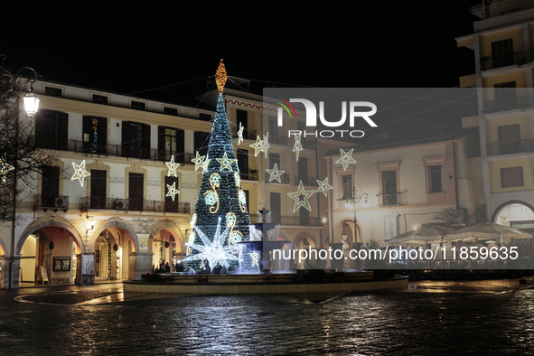 Christmas lights and a tree adorn the main square in Cava de'Tirreni, Salerno, Italy, on December 11, 2024. 