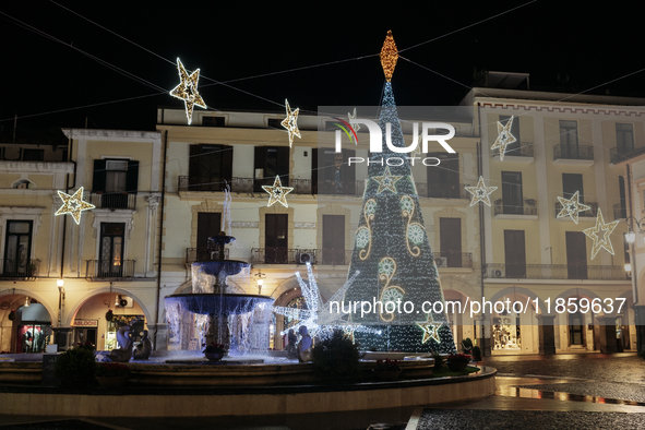 Christmas lights and a tree adorn the main square in Cava de'Tirreni, Salerno, Italy, on December 11, 2024. 