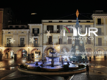 Christmas lights and a tree adorn the main square in Cava de'Tirreni, Salerno, Italy, on December 11, 2024. (