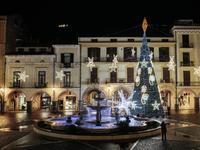 Christmas lights and a tree adorn the main square in Cava de'Tirreni, Salerno, Italy, on December 11, 2024. (