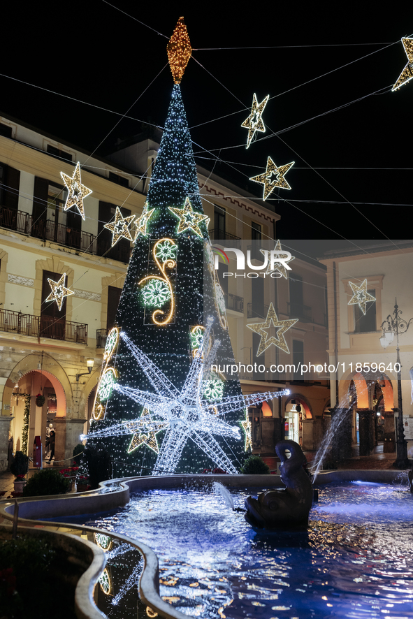 Christmas lights and a tree adorn the main square in Cava de'Tirreni, Salerno, Italy, on December 11, 2024. 