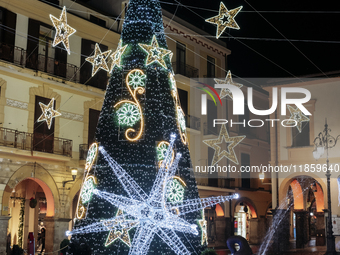 Christmas lights and a tree adorn the main square in Cava de'Tirreni, Salerno, Italy, on December 11, 2024. (