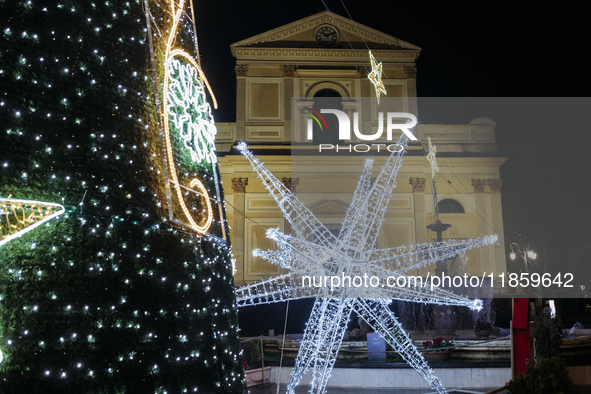 Christmas lights and a tree adorn the area in front of the Cathedral in Cava de'Tirreni, Salerno, Italy, on December 11, 2024. 