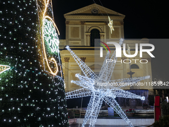 Christmas lights and a tree adorn the area in front of the Cathedral in Cava de'Tirreni, Salerno, Italy, on December 11, 2024. (