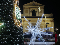 Christmas lights and a tree adorn the area in front of the Cathedral in Cava de'Tirreni, Salerno, Italy, on December 11, 2024. (