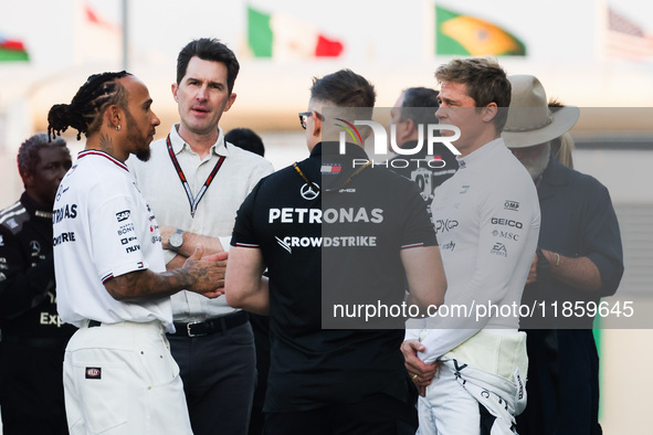 Lewis Hamilton of Mercedes, Brad Pitt, actor playing Sonny Hayes, a driver of the fictional Apex APXGP F1 team in the upcoming 'F1' movie an...