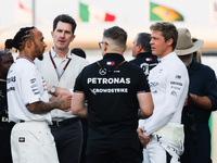 Lewis Hamilton of Mercedes, Brad Pitt, actor playing Sonny Hayes, a driver of the fictional Apex APXGP F1 team in the upcoming 'F1' movie an...