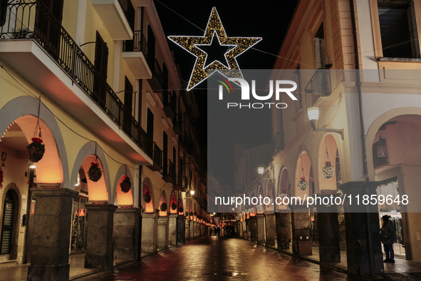 Christmas lights adorn the arcades and the city center in Cava de'Tirreni, Salerno, Italy, on December 11, 2024. 