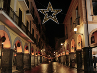 Christmas lights adorn the arcades and the city center in Cava de'Tirreni, Salerno, Italy, on December 11, 2024. (