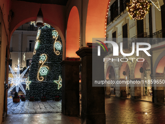 Christmas lights adorn the arcades and the city center in Cava de'Tirreni, Salerno, Italy, on December 11, 2024. (