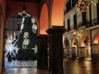 Christmas lights adorn the arcades and the city center in Cava de'Tirreni, Salerno, Italy, on December 11, 2024. (