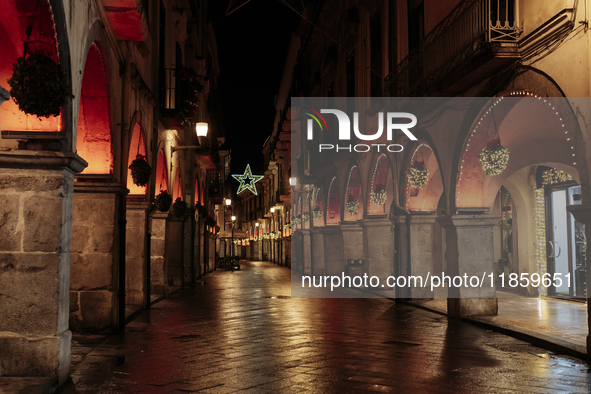 Christmas lights adorn the arcades and the city center in Cava de'Tirreni, Salerno, Italy, on December 11, 2024. 