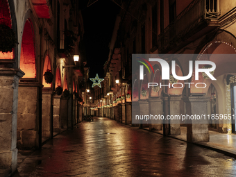 Christmas lights adorn the arcades and the city center in Cava de'Tirreni, Salerno, Italy, on December 11, 2024. (