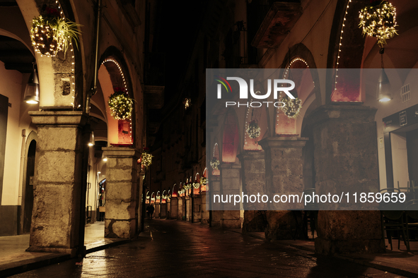 Christmas lights adorn the arcades and the city center in Cava de'Tirreni, Salerno, Italy, on December 11, 2024. 