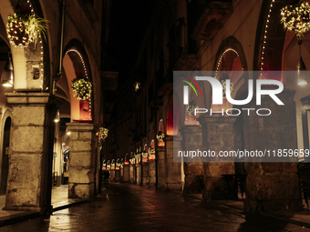 Christmas lights adorn the arcades and the city center in Cava de'Tirreni, Salerno, Italy, on December 11, 2024. (