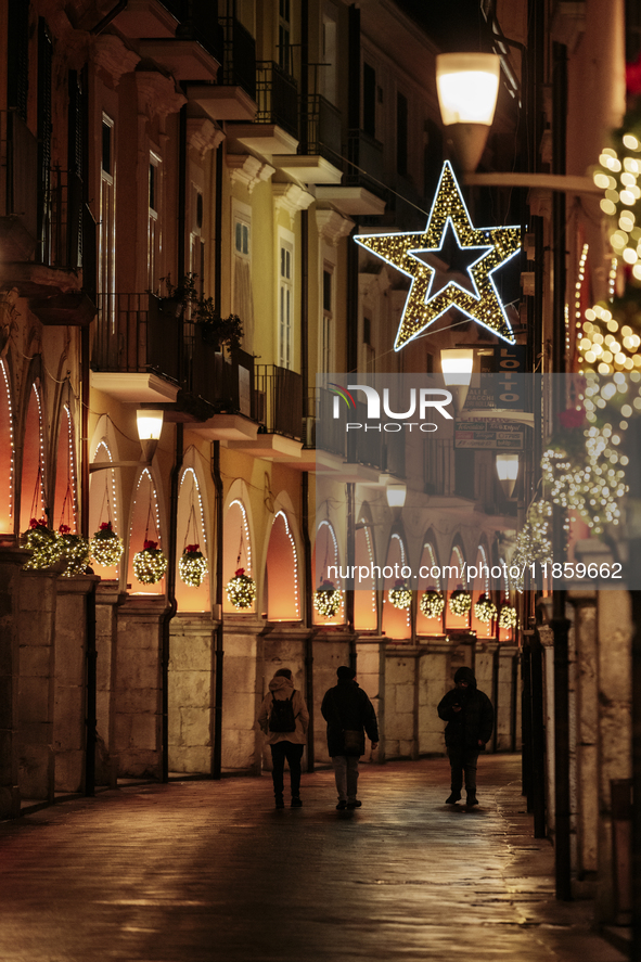 Christmas lights adorn the arcades and the city center in Cava de'Tirreni, Salerno, Italy, on December 11, 2024. 