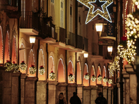 Christmas lights adorn the arcades and the city center in Cava de'Tirreni, Salerno, Italy, on December 11, 2024. (