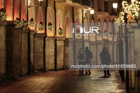 Christmas lights adorn the arcades and the city center in Cava de'Tirreni, Salerno, Italy, on December 11, 2024. 