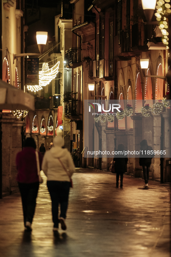 Christmas lights adorn the arcades and the city center in Cava de'Tirreni, Salerno, Italy, on December 11, 2024. 