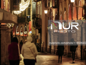 Christmas lights adorn the arcades and the city center in Cava de'Tirreni, Salerno, Italy, on December 11, 2024. (