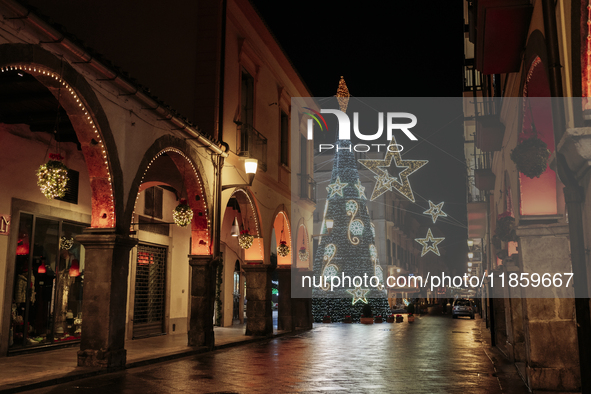 A big Christmas tree and Christmas lights adorn the arcades and the city center in Cava de'Tirreni, Salerno, Italy, on December 11, 2024. 