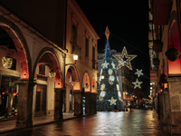 A big Christmas tree and Christmas lights adorn the arcades and the city center in Cava de'Tirreni, Salerno, Italy, on December 11, 2024. (