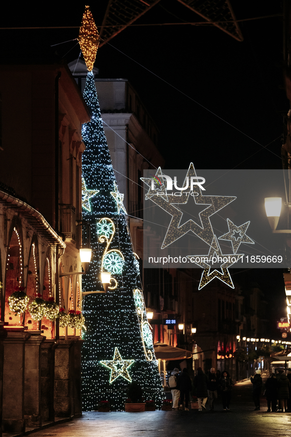 A big Christmas tree and Christmas lights adorn the arcades and the city center in Cava de'Tirreni, Salerno, Italy, on December 11, 2024. 