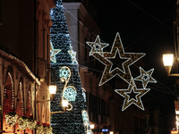 A big Christmas tree and Christmas lights adorn the arcades and the city center in Cava de'Tirreni, Salerno, Italy, on December 11, 2024. (